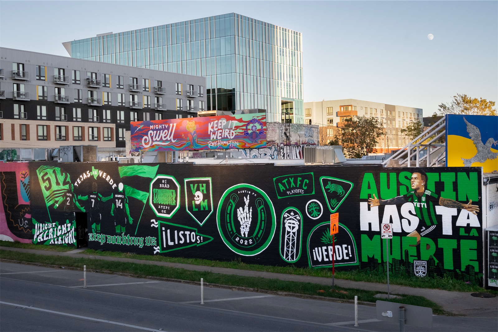 The full Austin FC panorama, viewed at an angle with buildings and sky in the background