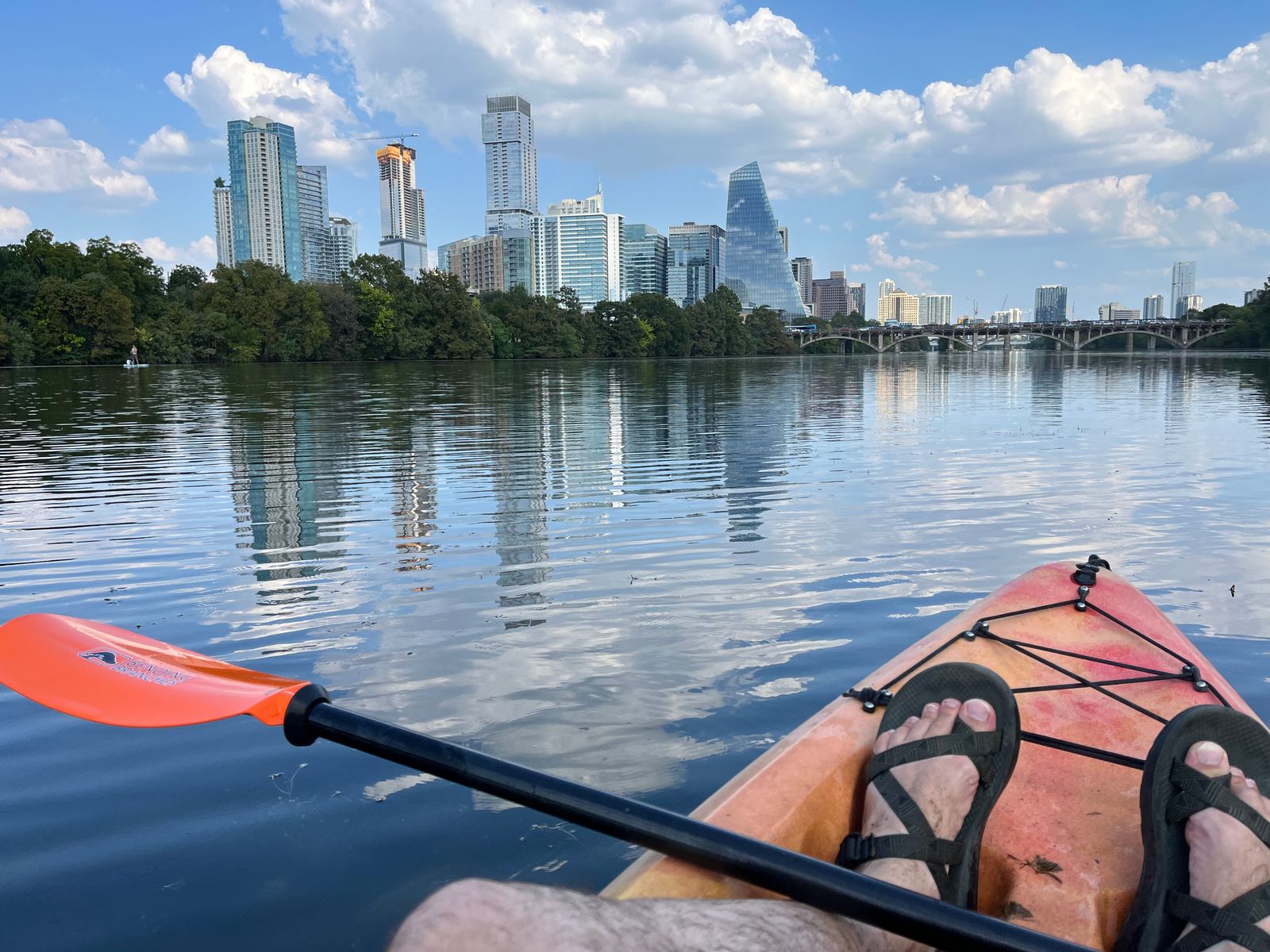 Kayaking in downtown Austin with the city skyline in the background