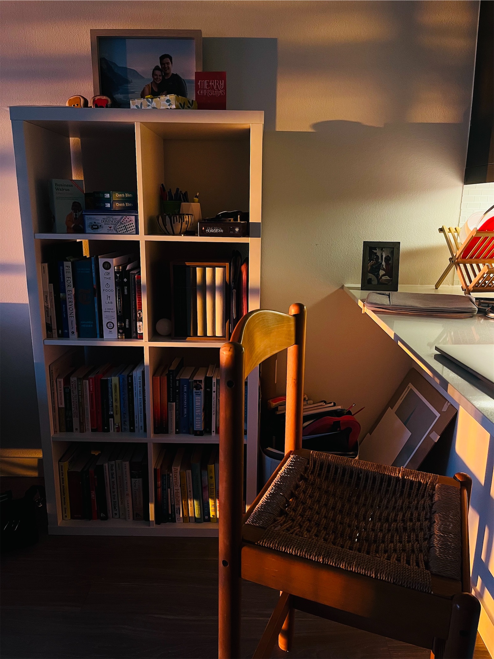 The red glow of a sunrise cast into an apartment