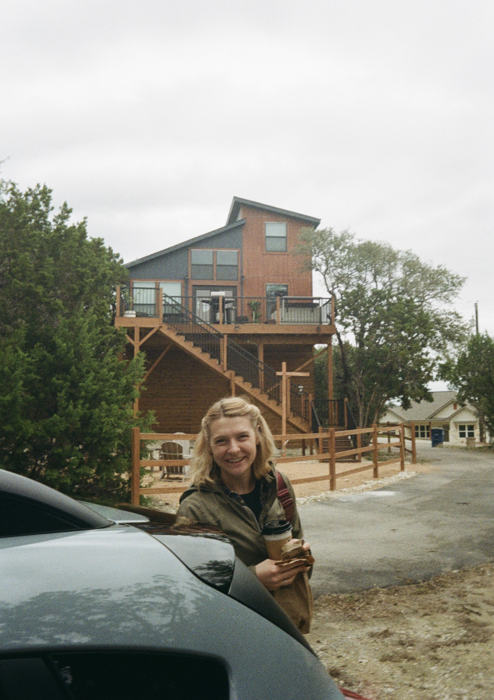 My wife standing in front of a cabin